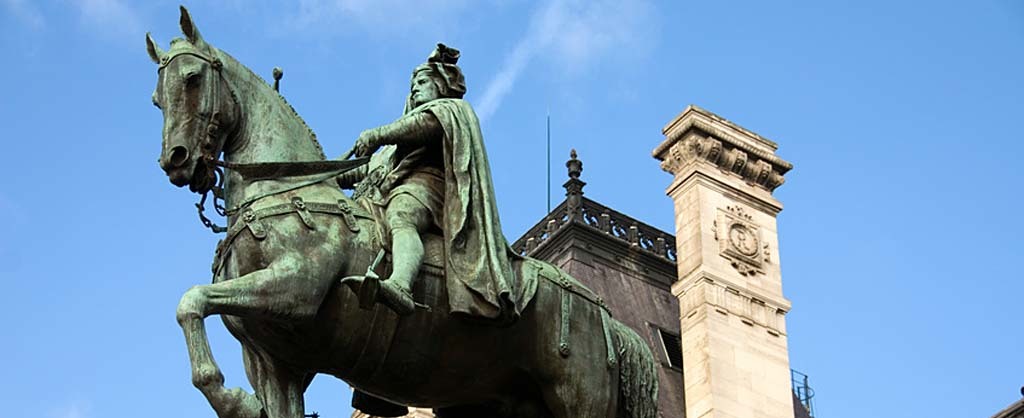 The bronze statue of Etienne Marcel proudly standing beside the Hotel de Ville, Paris, France