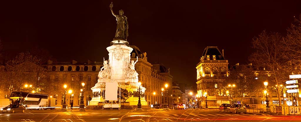 Marianne statue on the Republic square at night in Paris France